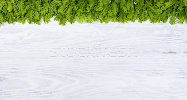 New fir tree branch tips on white wooden boards for the seasonal Stock photo © tab62