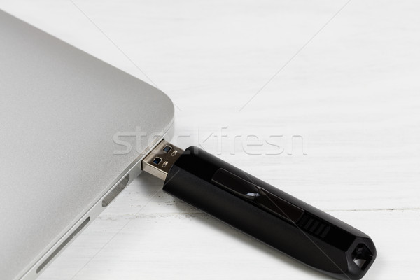 Thumb drive plugged into laptop computer Stock photo © tab62