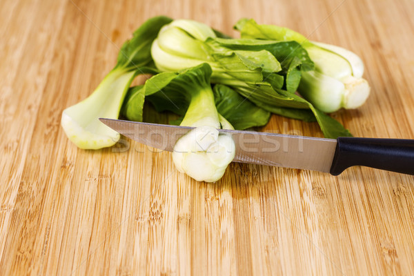 Asian Choy Vegetable been cut with Knife on Bamboo board  Stock photo © tab62