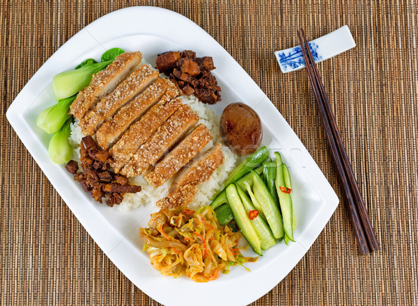 Stock photo: Fried bread coated pork slice dish and vegetables on white plate