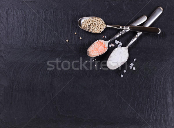 Spoons with a variety of spices on slate background  Stock photo © tab62