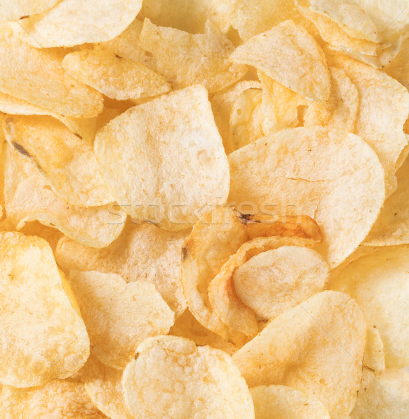 Filled frame of crunchy fresh potato chips Stock photo © tab62