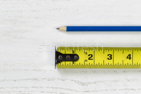 Tape Measure with sharpen pencil on wooden boards Stock photo © tab62