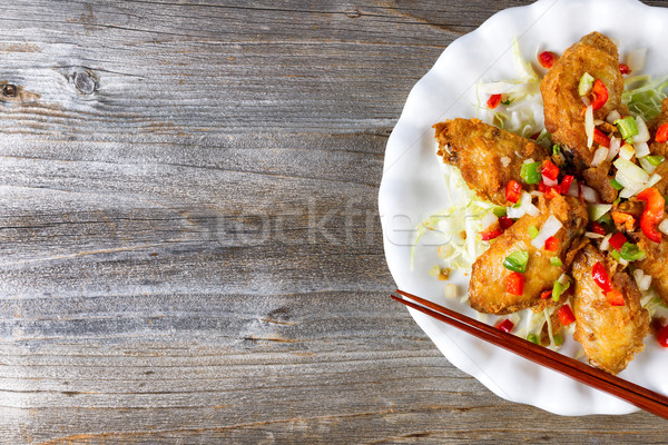 Asian style chicken wings on rustic wooded boards  Stock photo © tab62