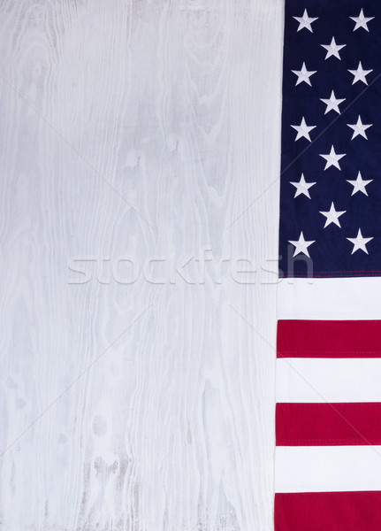 Folded USA flag on white wood background  Stock photo © tab62