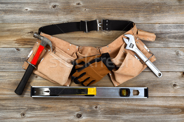 Leather tool belt with tools on rustic wooden boards  Stock photo © tab62