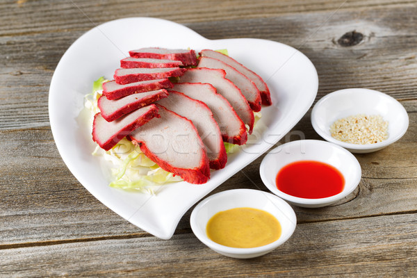 Freshly sliced pork with dipping sauces ready to eat Stock photo © tab62