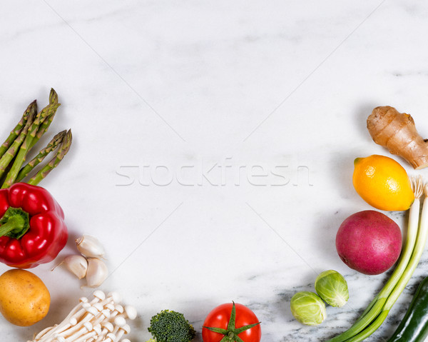 Fresh whole vegetables and fruit displayed on natural marble sto Stock photo © tab62