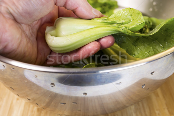 Cleaning fresh vegetables in stainless bowl filled with water  Stock photo © tab62