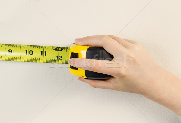 Tape Measure against white wall  Stock photo © tab62