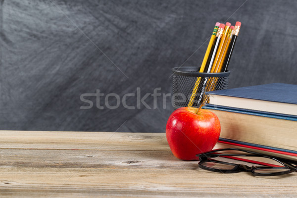 Old wooden desktop with reading materials and blackboard  Stock photo © tab62