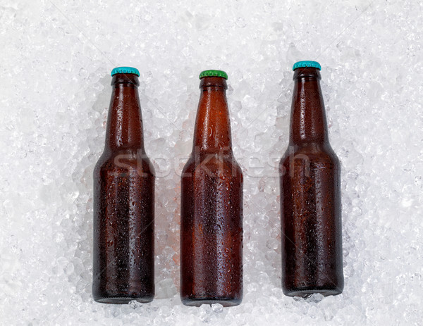 Bottles of beer being chilled on pile of ice  Stock photo © tab62