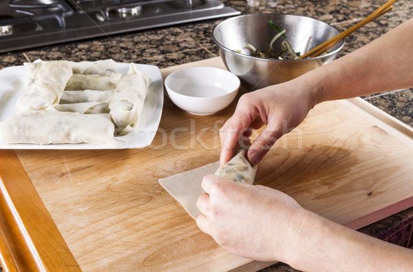 Creating homemade Chinese Spring Rolls in kitchen  Stock photo © tab62