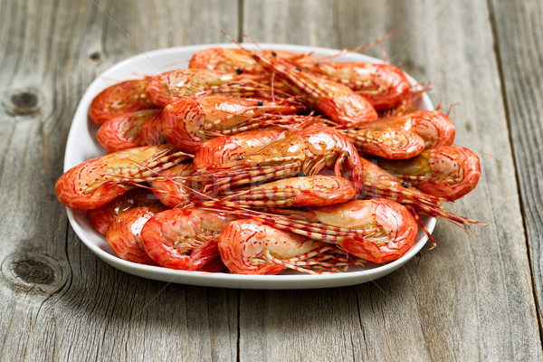 Fresh Steamed Shrimp in White Plate with rustic wood  Stock photo © tab62