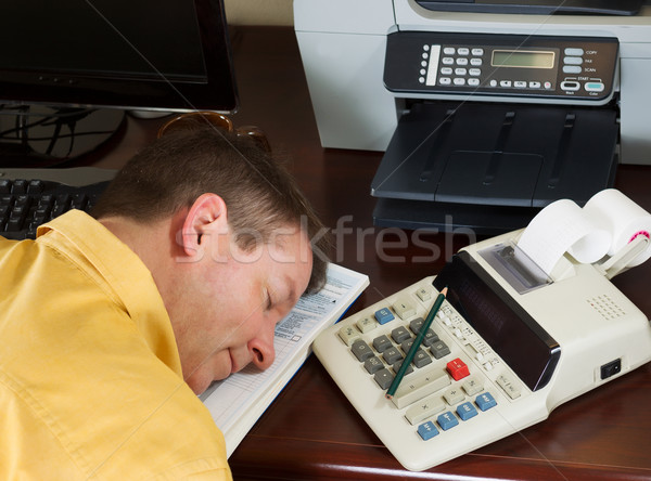 Mature man resting from doing his income taxes  Stock photo © tab62
