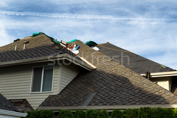 Home roof being replaced with new composite roofing materials Stock photo © tab62