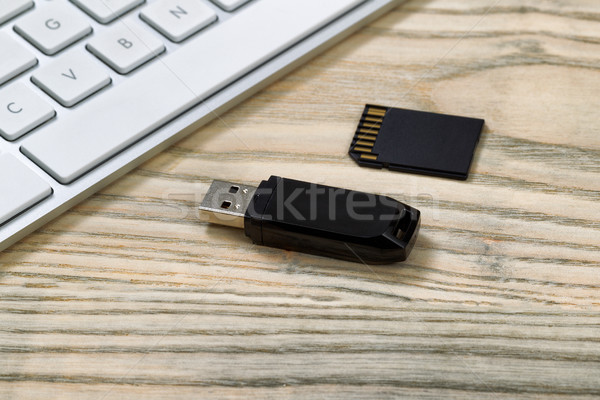 Close up of a data storage devices on wooden desktop  Stock photo © tab62