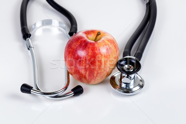 Good health with fresh red apple and stethoscope  Stock photo © tab62