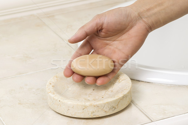 Female hand picking up bar of soap  Stock photo © tab62