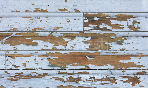 Old lead paint peeling off of wood sliding Stock photo © tab62