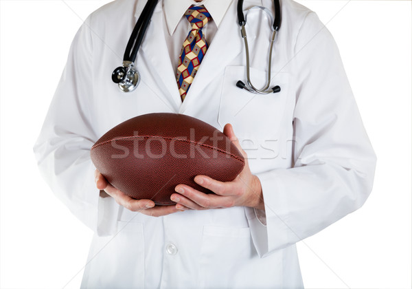 Medical doctor holding Football in hands Stock photo © tab62