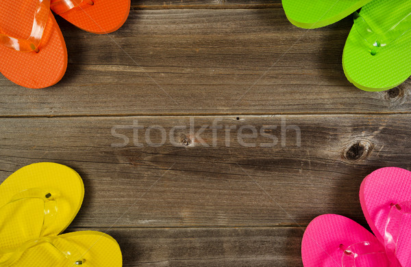 Sandal tops forming circle on wooden boards  Stock photo © tab62