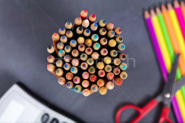 Colorful pencil tips with student supplies and erased chalkboard Stock photo © tab62