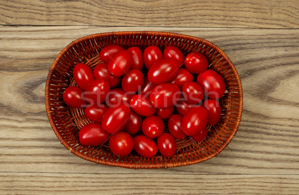 Basket of fresh Grape Tomatoes on Age Wood  Stock photo © tab62