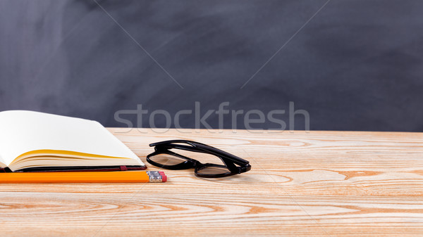 Back to school basic objects in front of erased black chalkboard Stock photo © tab62