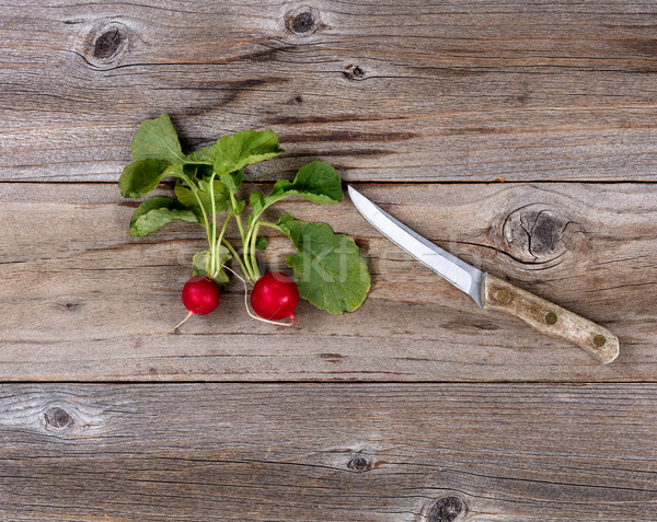 Fresh radish and paring knife on rustic wood  Stock photo © tab62