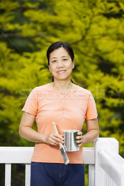 Mature woman relax while painting outdoor deck railing  Stock photo © tab62