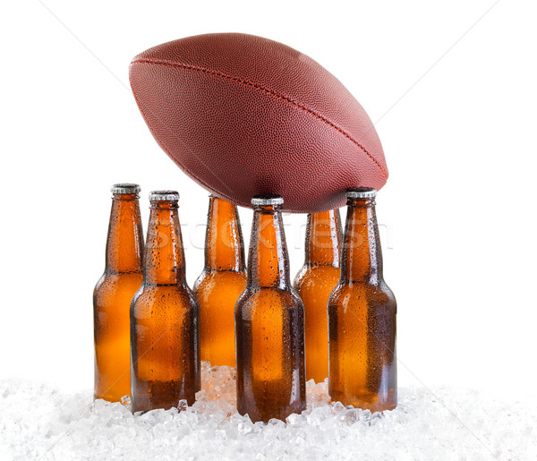 Six pack of ice cold bottled beer with American football isolate Stock photo © tab62