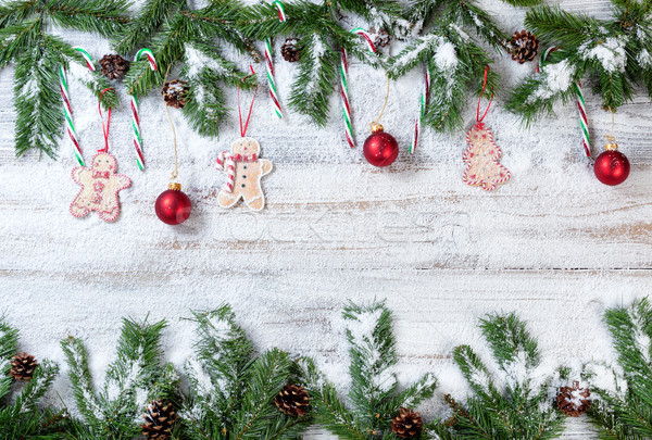 Snowy Christmas branches with associated ornaments on rustic whi Stock photo © tab62