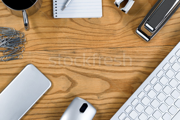 Wooden desktop with border of silver color working items Stock photo © tab62