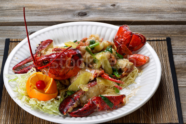 Steamed whole Maine lobster and garnishes on white serving plate Stock photo © tab62
