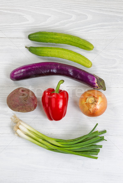 Freshly picked vegetables on white wood background Stock photo © tab62