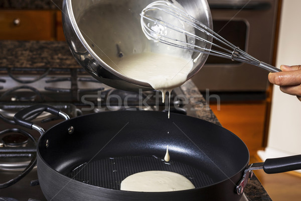 Pouring Pancake Batter into frying pan  Stock photo © tab62