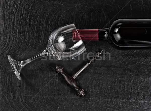 Overhead view of vintage corkscrew with red wine bottle and drin Stock photo © tab62