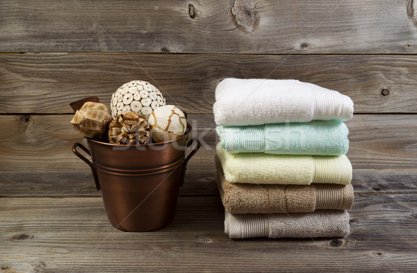 Clean stacked Towels and Bucket filled with Decorations on Weath Stock photo © tab62