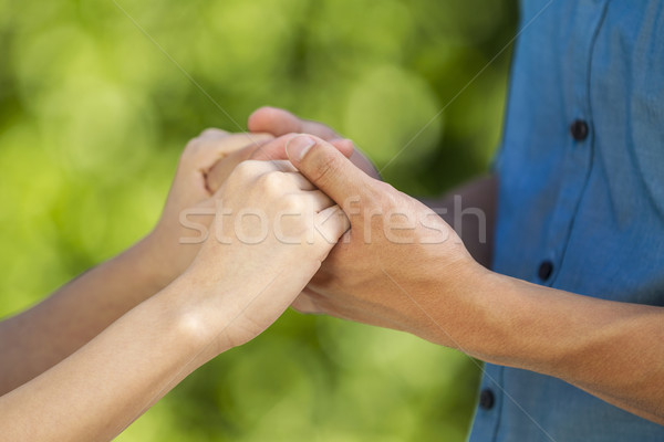 Lovers holding hands outdoors  Stock photo © tab62