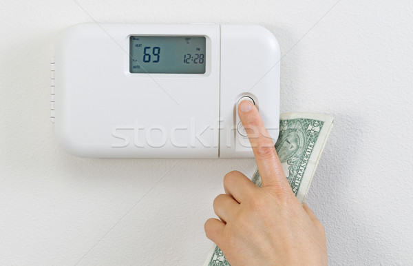 Saving money from heating home  Stock photo © tab62