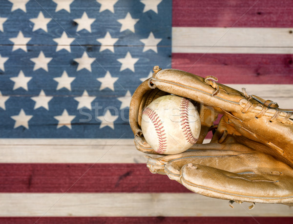 Weathered baseball mitt and ball with faded boards painted in Am Stock photo © tab62