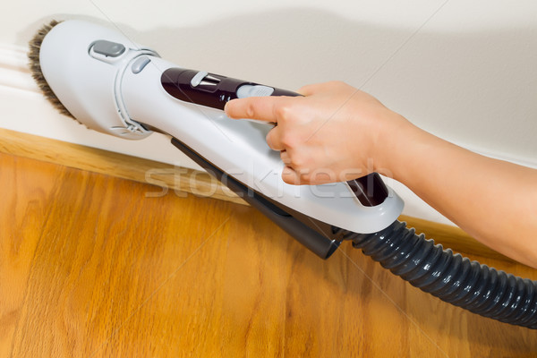 Cleaning Trim next to wooden floors Stock photo © tab62