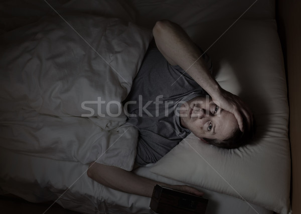 Mature man cannot fall asleep during night time  Stock photo © tab62