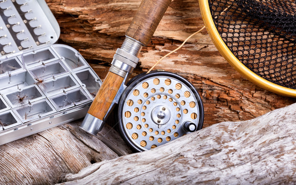 Stock photo: Vintage fly fishing outfit and gear on rocks and wood background