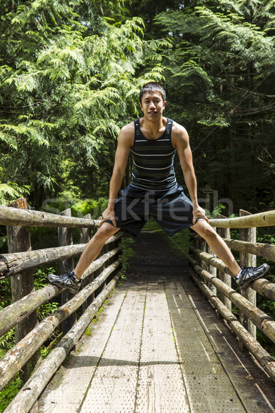 Athletic Young Man on Wooden Bridge  Stock photo © tab62