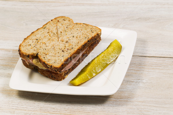 Fresh Ham Sandwich with Sliced Pickle on White Plate  Stock photo © tab62