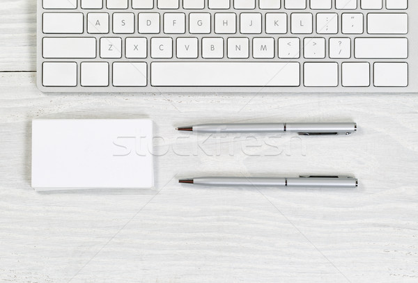 Stack of blank business cards and pens on white desktop  Stock photo © tab62