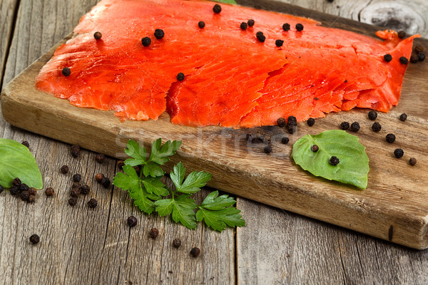 Close of cold smoked salmon on wooden server ready to eat  Stock photo © tab62