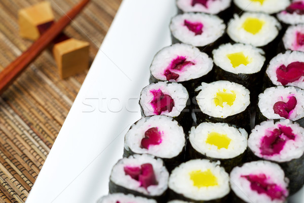 Large plated filled with Pickled Hand Rolled Sushi  Stock photo © tab62